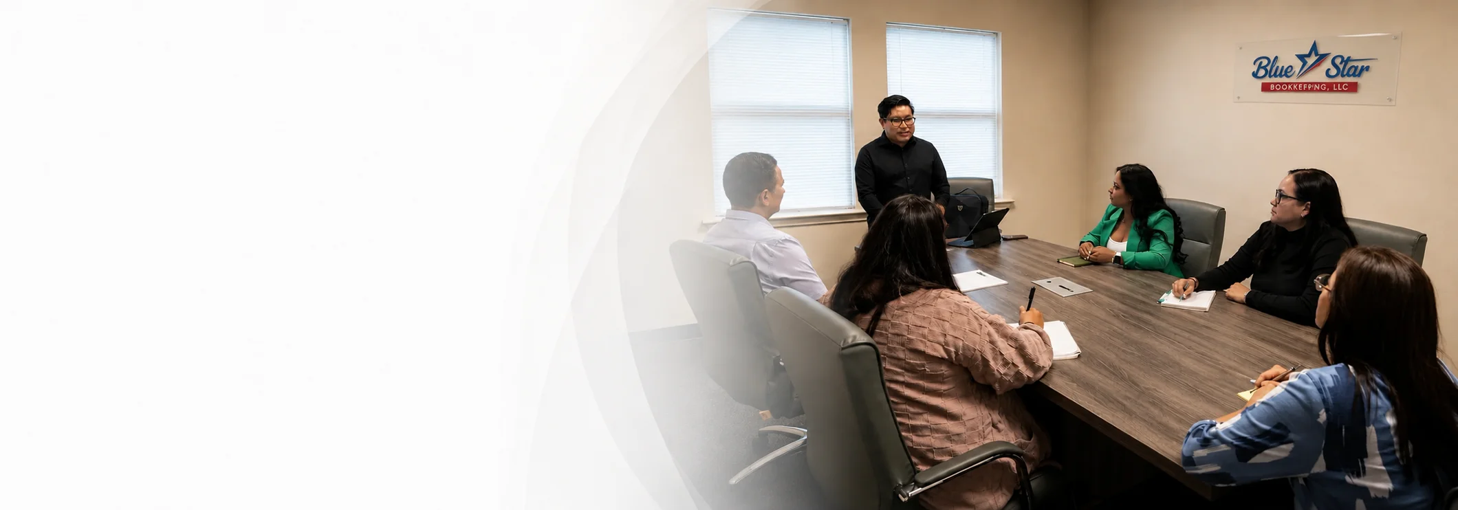 The Blue Star Bookkeeping team meeting with a small business client in Austin, TX