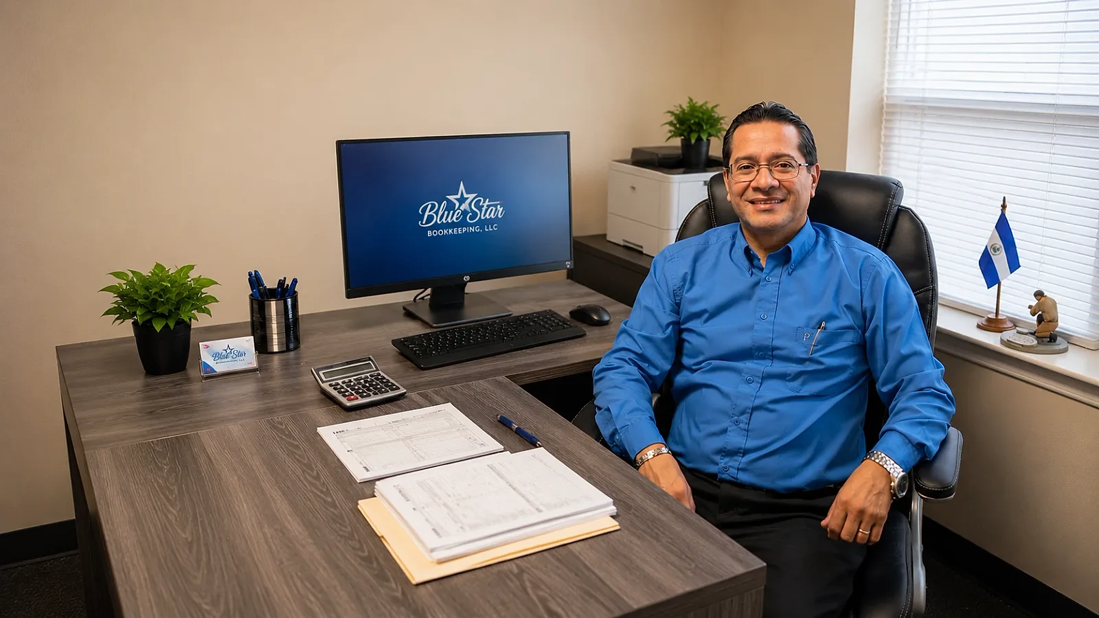 Manuel Bonilla at his desk in the Blue Star Bookkeeping office